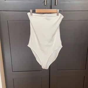 White strapless bodysuit. Never worn. Tags removed